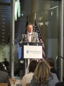 pho of Dr. Hubert Benitez speaking at the 2025 President's Reception