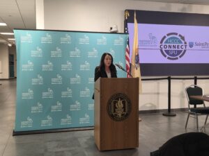 photo of Lisa Dougherty, senior vice president for student affairs and enrollment addressing the crowd