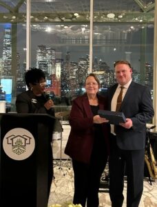 photo of Erich Sekel and Carol Mori accepting award
