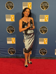photo of Ernabel Demillo with her Emmy
