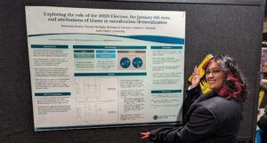 Ramona Urrutia presented a poster titled "Exploring the Role of the 2020 Election, the January 6th Riots, and Attributions of Blame in Moralization/Demoralization."