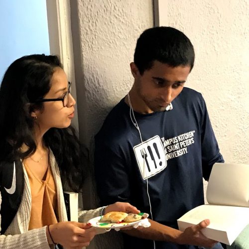 two history students at book fair and bake off