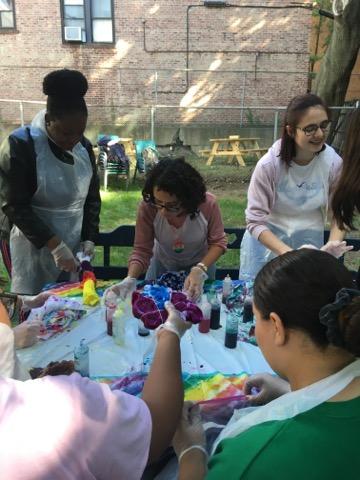 A group of students sits together and chooses their colors.