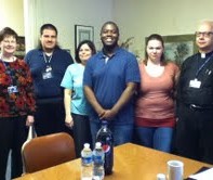 (l-r) Peggy Greenwood (secretary); Dr. Maria Calisi; John Holoduek, Jr; Marcus Johnson; Michele deVries; Fr. Edmund Majewski.