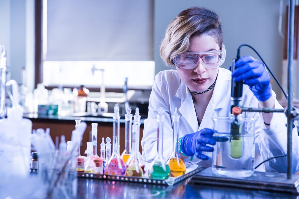 chemistry student with solutions