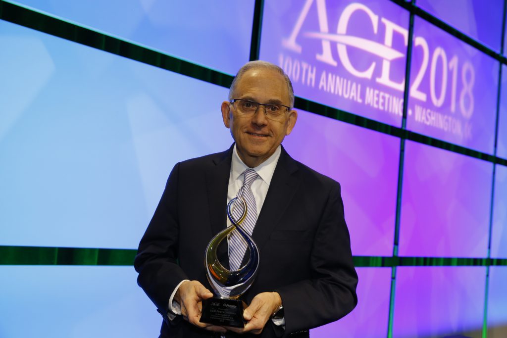 Eugene J. Cornacchia holding award